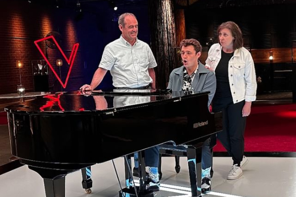 Sam Dearie with his parents on the set of "The Voice" television show.